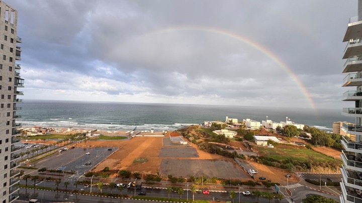 The Givat Olga shoreline in Hadera under a rainbow