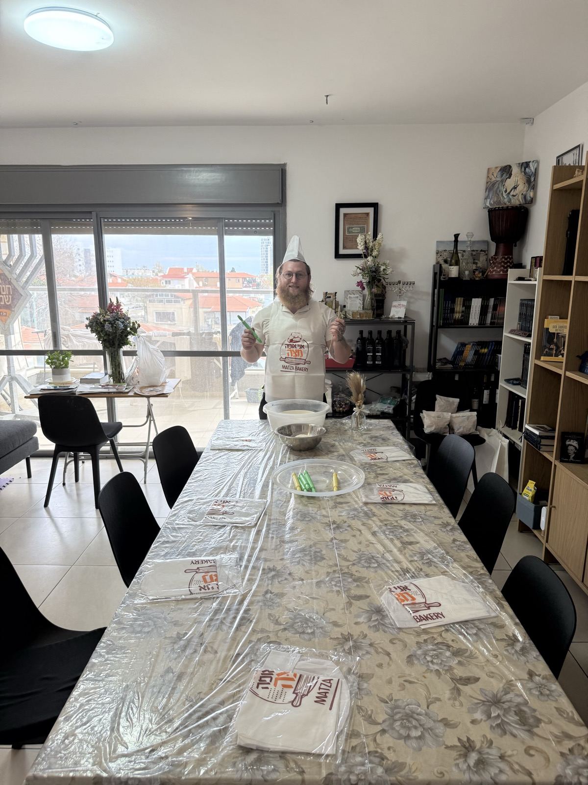 A long table ready for a matzah baking workshop